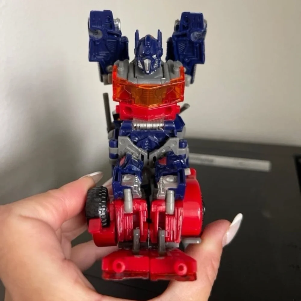 Hasbro Transforming Robot - Red, Blue, and Silver